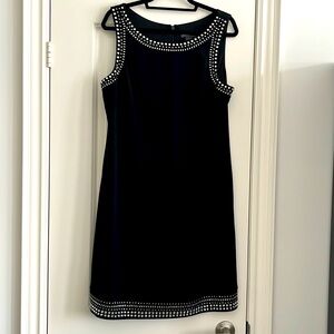 Black - sleeveless cocktail length, with sparkly rhinestone like embellishments